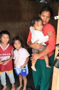 Alberta Maquiling with three of her children, [from left] Arniel, Marillen, and baby Carmela