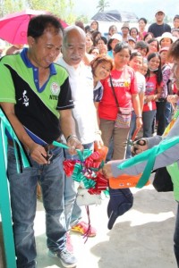 New Bataan Mayor Lorenzo Balbin, Jr. and Compostela Valley Governor Arturo Uy lead the cutting of the ribbon during the Women-Friendly Space opening in New Bataan, Compostela Valley.