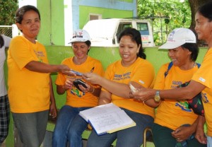 Juvy Pentes (2nd from left) works hard for her family and community