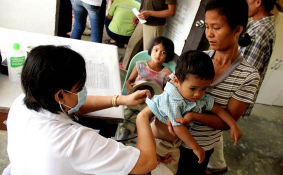 Sarrah makes sure to bring her kids to the health center just like this mother and son.