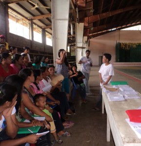 Alona presides a meeting of parent-leaders.