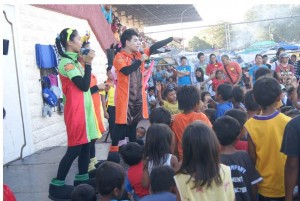 Youth volunteers from Victory Christian Fellowship facilitating art and play therapy program for children-evacuees at the Grandstand.
