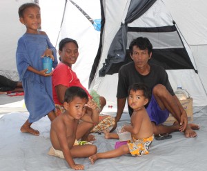 Rex Tabao and family pose inside their temporary home.