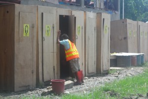 A male evacuee assigned in cleaning the portalets inside the Sta. Maria Elementary School