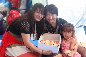 Mitch and Ramona join children-evacuees in a play therapy session. Mitch celebrates her birthday with the children and sponsored the play therapy session.