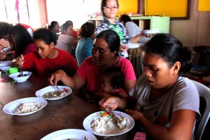 Pregnant women eat meals provided under the Supplementary Feeding Program, one of the interventions provided by the DSWD to the evacuees of the armed conflict and flooding in Zamboanga