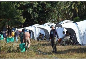 Members of the Response Team lead in the setting up of tents at the Loon South Central School evacuation center.