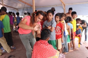 School-age kids lining up to get a free haircut 
