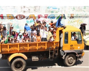 Going home! About 30 residents of Barangay Mampang wave goodbye to other evacuees on their way home. They have been staying at the JFE Sports Complex since the armed conflict in Zamboanga started on Sept. 9.