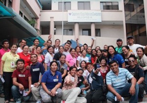 “Volunteers from University of the Southern Philippines, University of Cebu and other civil society groups and individuals striked a pose at the DSWD grounds after sorting and packing relief goods”