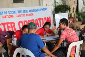 Social workers of the Department of Social Welfare and Development National Capital Region (DSWD-NCR) interview survivors who arrived via C-130 from Leyte and Samar Provinces over the weekend.