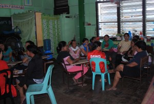Women-evacuees gather for a sharing session at the Women Friendly Space at Rizal Central School.