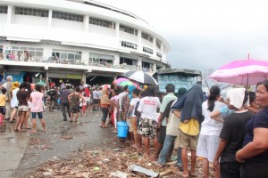 Evacuees at the Astrodome Evacuation Center in Sagkahan, Tacloban City lining up to get their food packs distributed by DSWD.