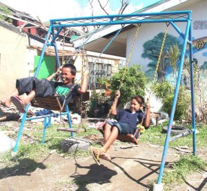 Cousins John Mike and Anthony play at the Sto. Nino SPED center park