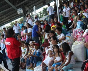 Director Bonoan talks to 'Yolanda' survivors who arrived at Villamor Airbase.