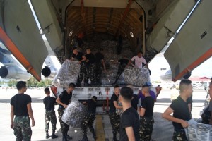 Soldiers unload the relief items donated by the government of Ukraine.