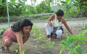Rosemarie and Jocelyn working together in their communal garden.