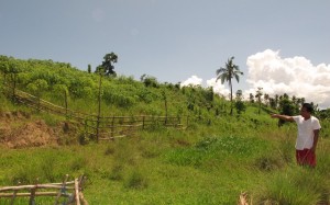 Brgy Capt Erwin shows the piece of land where they will set up the communal garden of Brgy. Planza.