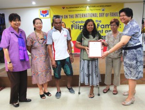 Criselda receives a Plaque of Appreciation from the members of the NCFF for being one of the speakers during the forum.