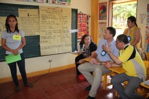 DSWD Region V Director Arnel Garcia explains a point to Australian Embassy officials as they sit in during a Family Development Session.