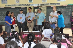 Australian officials interact with children during their visit to one of the classrooms constructed using Australian grants.