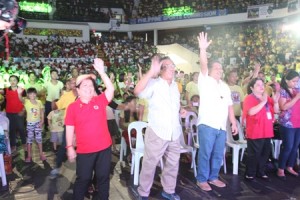 Sec. Soliman, DOH Sec. Ona, and DepEd Sec. Luistro gesture while watching a dance number by the beneficiaries