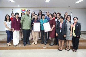 Usec. Medel (4th from left) and Usec. Parisya Taradji (fifth from left) receives the ISO-Certification.