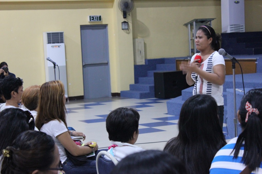 Divine is teary-eyed as she shares her struggles before becoming a beneficiary of the Modified Conditional Cash Transfer for Homeless Street Families.