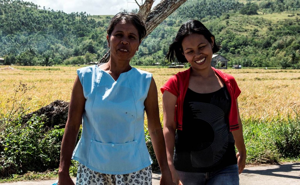 Necita Mesa (right) is one of the female paid laborers employed in the construction of their 1.7 km access path.