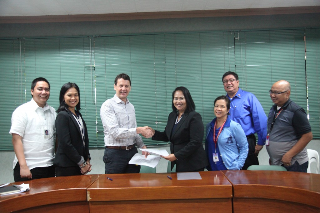 DSWD Assistant Secretary Vilma Cabrera and Australian Department of Foreign Affairs and Trade Counsellor Geoff King seal the partnership after signing the inception report. Also in photo are (from left to right): Mr. Pablo Lucero and Ms. Anne Orquiza from the Australian Embassy; DSWD Disaster Response and Management Bureau (DreamB) Director Tess Briones; DSWD Technical Assistance Unit Senior Technical Officer Gil Tuparan; and Administrative Service Director Nicomedes Suller.​