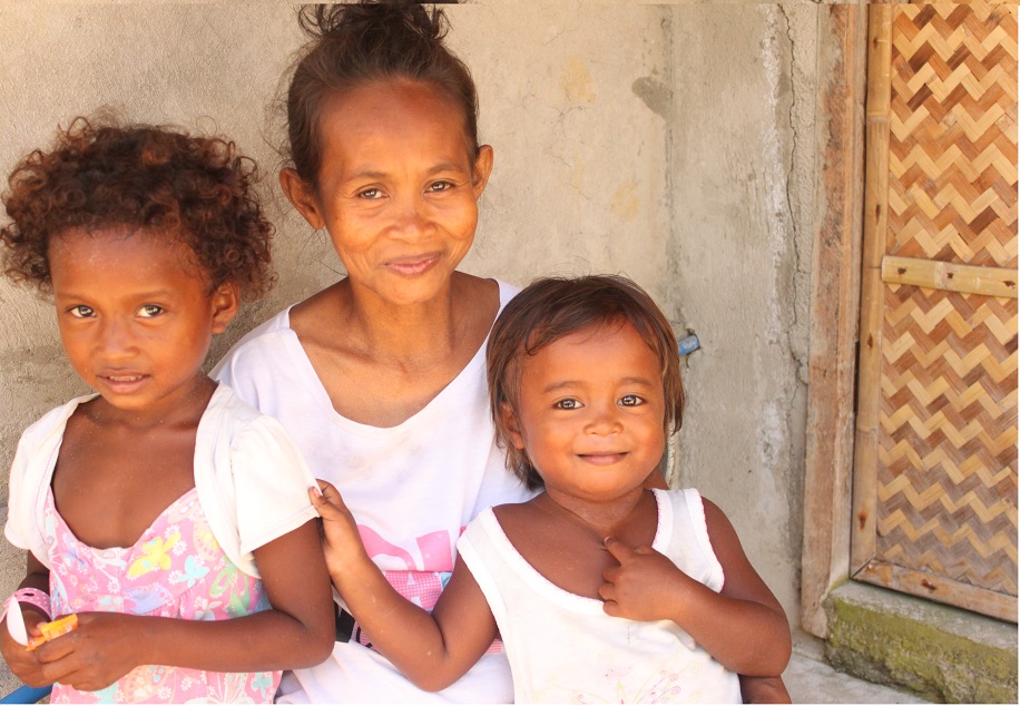 Leonida, with her two young kids, is thankful for the help and attention her family is getting from the government.