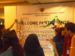 Representatives of academic institutions who attended the orientation on DSWD initiatives for homeless families post their commitments to help address the concerns of street dwellers in the cities of Manila and Quezon.