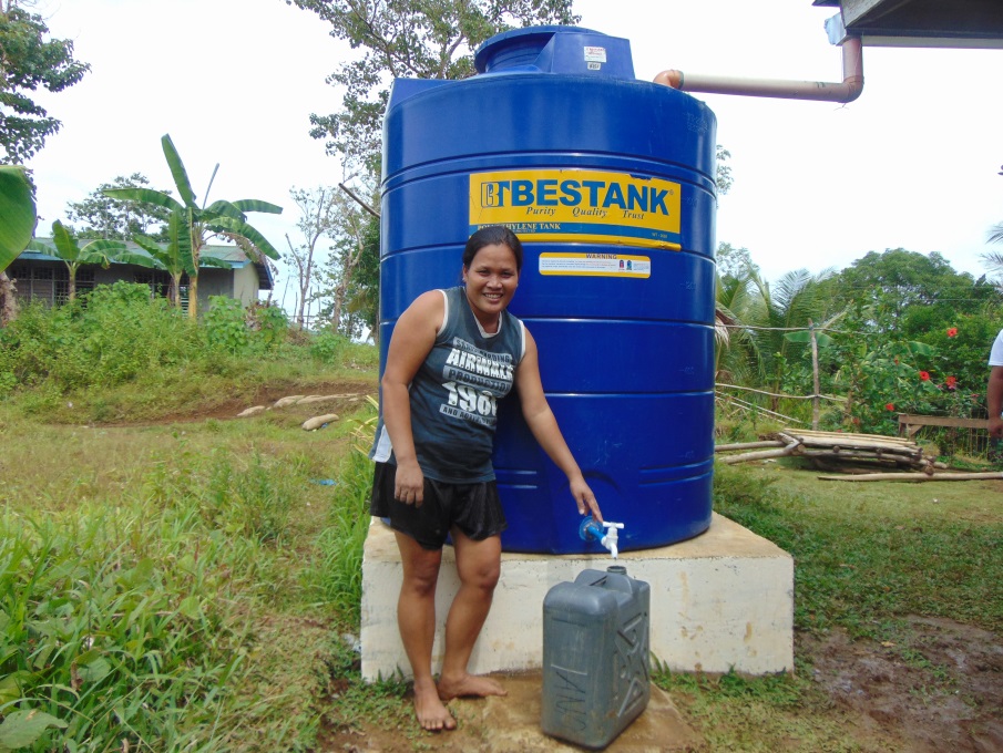 Analyn Berso, a resident and a Kalahi-CIDSS volunteer of Barangay Magsaysay, now has no problems fetching water because they now have a rain water harvester.