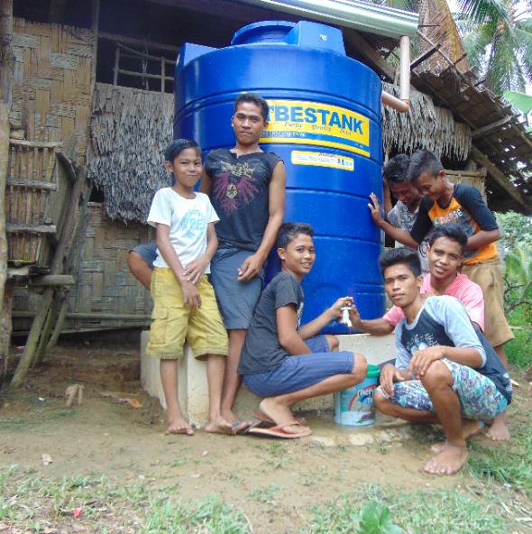 Children in Brgy.Magsaysay are cheerfully showing their water system sub-project.