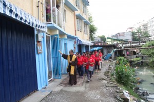  Informal settler family-beneficiaries of the Micro Medium Rise Buildings witness the blessing of the housing units.