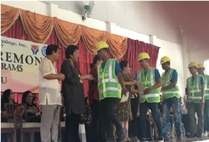 DSWD Secretary Judy Taguiwalo (2nd from left) congratulates and engages in light banter with the graduates who were displaced by the 2013 Zamboanga siege.