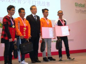 From Left to Right: Student winners Nathaniel Edward Q. Dimalanta, Mark Christian D. Evangelista, Rey Chabby C. Estrera and Kahlil A. Guanco of the Philippine team proudly showcase their certificates of recognition and medals with an official of the 2016 Global IT Challenge (GITC) for Youth with Disabilities during its awarding ceremony held in Yangzhou, Jiangsu, China last November 25, 2016.