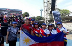 DSWD representatives, Asec. Hernandez, and Olympic Silver Medalist Hidilyn Diaz (third from right) at the conclusion of the culminating program for the Manila leg of the #RisingTogether Baton Run. 