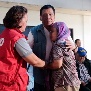 Department of Social Welfare and Development (DSWD) Undersecretary for Operations and Protective Programs Hope Hervilla joins President Rodrigo R. Duterte yesterday as he comforts an evacuee from Marawi City during his visit to Buru-un School of Fisheries, one of the identified evacuation centers where Marawi residents are currently staying at. Photo from Presidential Communications Operations Office.