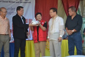 Department of Social Welfare and Development Undersecretary for Legislative Liaison Affairs and Special Presidential Directives in the Mindanao Region, Luzviminda Ilagan and National Food Authority Administrator Jason Aquino (second from left) receive the rice donation from the Government of Japan through the Association of Southeast Asian Nations (ASEAN) Plus Three Emergency Rice Reserve (APTERR) during the ceremonial turnover held at the Mahad Markazi Evacuation Center in Baloi, Lanao del Norte.