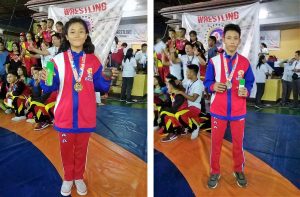 DSWD Pantawid children-beneficiaries Jezza A. Villaraza and Angelo P. Aganan pose with their medals during the awarding ceremony of the wrestling competition of Palarong Pambansa 2018. Jezza took home the gold medal after dominating the wrestling match for girls in the secondary level under the 40 kg. cadet category, while Angelo bagged a bronze medal in the match for boys in the secondary level under the 46 kg. cadet category. (Photo credit: DepEd Wrestling Masbate Province)
