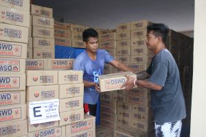 Warehouse personnel of DSWD Field Office in Region II prepare family food packs (FFPs) for distribution to cities and municipalities in Cagayan Valley that may be affected by Typhoon Rosita.