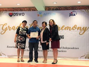 Mr. Ronald Busnagan, a houseparent from Nayon ng Kabataan, a residential care facility of the Department of Social Welfare and Development (DSWD), receives his Certificate of Completion after finishing the training on houseparenting provided by the DSWD, Japanese non-profit group, A Child’s Trust is Ours to Nurture (ACTION), and Japan International Cooperation Agency (JICA) under the project, "Ensuring Children’s Potential for Development and Independence Through Improved Residential Care Practices.”