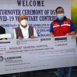 Department of Social Welfare and Development (DSWD) Undersecretary for General Administration and Support Services Group Jose Ernesto B. Gaviola (2nd from right) and Field Office Cordillera Administrative Region Director Leo Quintilla (right) hand over to Benguet Province Governor Dr. Melchor D. Diclas (2nd from left) and Benguet General Hospital Chief Dr. Meliarazon Dulay (left) the check for the P4 million DSWD donation to the hospital.