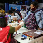 Locally stranded individuals (LSIs) staying in Pier 4, North Port, Manila receive financial assistance from the Department of Social Welfare and Development (DSWD) Field Office National Capital Region (NCR).