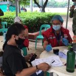 A social worker of the Department of Social Welfare and Development (DSWD) facilitates the payout of financial aid to a locally stranded individual during the Hatid Tulong Grand Send Off at Quirino Grandstand.