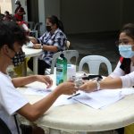 Social workers of the Department of Social Welfare and Development (DSWD) distribute financial aid to locally stranded individuals (LSIs) during the third Hatid Tulong Grand Send-Off at the Cultural Center of the Philippines (CCP) Complex, Pasay City on October 19.