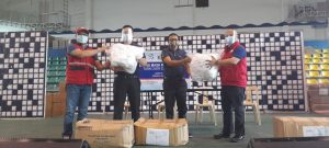 Department of Social Welfare and Development (DSWD) Undersecretary Rene Glen O. Paje (right) hands over the boxes of washable face masks to representatives of the Provincial Government of Cavite. He was joined by DSWD Field Office CALABARZON-Disaster Risk Reduction and Management Division Chief Ricky Bunao (left).