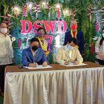 Department of Social Welfare and Development (DSWD) Secretary Rolando Joselito D. Bautista (seated left) and Butuan City Mayor Ronnie Vicente Lagnada sign the Memorandum of Agreement for the establishment of the Mindanao Disaster Resource Center. Also in the photo to witness the MOA signing are DSWD Undersecretary Luzviminda Ilagan (standing 2nd from right) and DSWD CARAGA Regional Director Ramel Jamen (standing second from left).