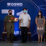 Department of Social Welfare and Development Secretary Rolando Joselito Bautista, Field Office X Director Mari-Flor Dollaga-Libang, and Lieutenant Colonel Jenny De Mesa pose for a souvenir photo after the awarding of the Salamat po Awards on March 25.